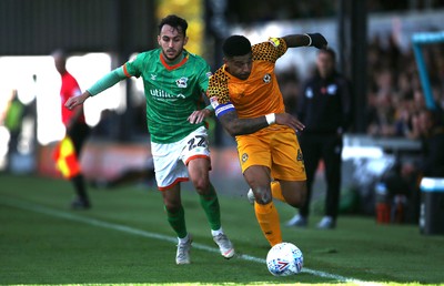 191019 - Newport County v Scunthorpe United - SkyBet League Two - Joss Labadie of Newport County is challenged by Levi Sutton of Scunthorpe United