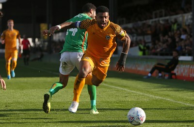 191019 - Newport County v Scunthorpe United - SkyBet League Two - Joss Labadie of Newport County is tackled by James Perch of Scunthorpe United