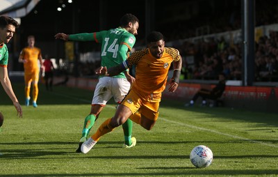 191019 - Newport County v Scunthorpe United - SkyBet League Two - Joss Labadie of Newport County is tackled by James Perch of Scunthorpe United