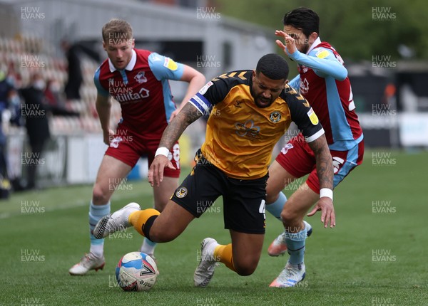 270421 - Newport County v Scunthorpe United - SkyBet League Two - Joss Labadie of Newport County is tackled by Jem Karacan of Scunthorpe