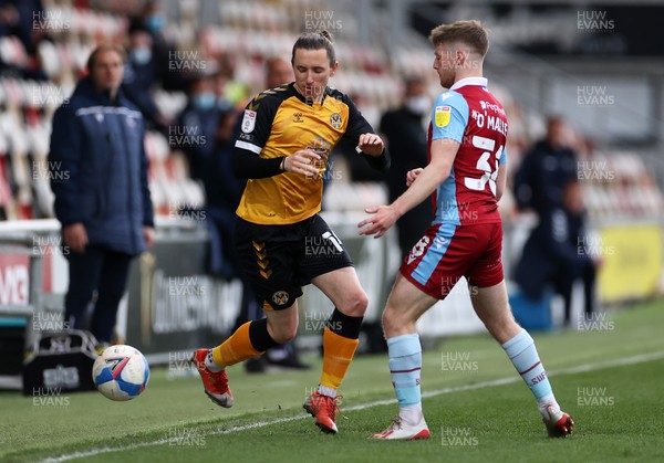 270421 - Newport County v Scunthorpe United - SkyBet League Two - Aaron Lewis of Newport County is tackled by Mason O'Malley of Scunthorpe