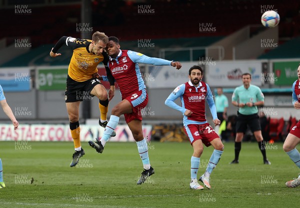 270421 - Newport County v Scunthorpe United - SkyBet League Two - Mickey Demetriou of Newport County headers the ball to score their second goal