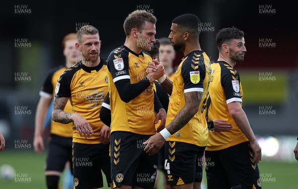 270421 - Newport County v Scunthorpe United - SkyBet League Two - Mickey Demetriou of Newport County celebrates scoring a goal with team mates
