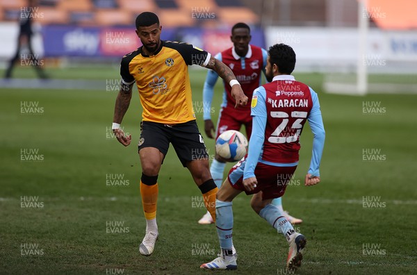 270421 - Newport County v Scunthorpe United - SkyBet League Two - Joss Labadie of Newport County is challenged by Jem Karacan of Scunthorpe