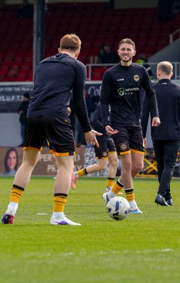 280326 - Newport County v Shrewsbury Town - Sky Bet League 2 - Matthew Baker of Newport County warms up prior to kick off