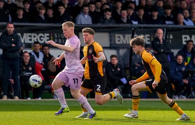 280326 - Newport County v Shrewsbury Town - Sky Bet League 2 - Anthony Scully of Shrewsbury Town controls the ball whilst under pressure from Cameron Evans and Ben Lloyd of Newport County