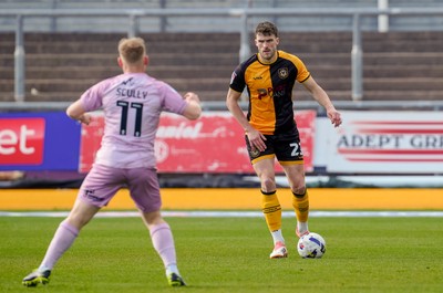 280326 - Newport County v Shrewsbury Town - Sky Bet League 2 - Ryan Delaney of Newport County controls the ball whilst under pressure from Anthony Scully of Shrewsbury Town