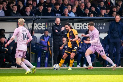 280326 - Newport County v Shrewsbury Town - Sky Bet League 2 - Liam Shephard of Newport County passes the ball whilst under pressure from Iwan Morgan of Shrewsbury Town