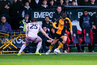 280326 - Newport County v Shrewsbury Town - Sky Bet League 2 - Ben Lloyd of Newport County takes on Josh Ruffels of Shrewsbury Town