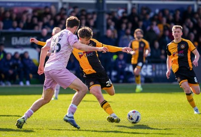 280326 - Newport County v Shrewsbury Town - Sky Bet League 2 - Ben Lloyd of Newport County has a chance whilst under pressure from Sam Stubbs of Shrewsbury Town