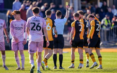 280326 - Newport County v Shrewsbury Town - Sky Bet League 2 - Cameron Evans of Newport County is shown a yellow card