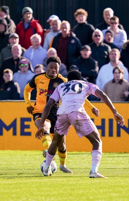 280326 - Newport County v Shrewsbury Town - Sky Bet League 2 - Bobby Kamwa of Newport County takes on  Kevin Berkoe of Shrewsbury Town