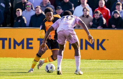 280326 - Newport County v Shrewsbury Town - Sky Bet League 2 - Bobby Kamwa of Newport County takes on  Kevin Berkoe of Shrewsbury Town