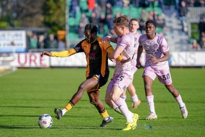 280326 - Newport County v Shrewsbury Town - Sky Bet League 2 - Nathan Opoku of Newport County is challenged by Josh Ruffels of Shrewsbury Town