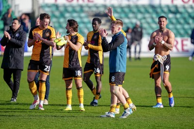 280326 - Newport County v Shrewsbury Town - Sky Bet League 2 - Players of Newport County applauds the fans following the match