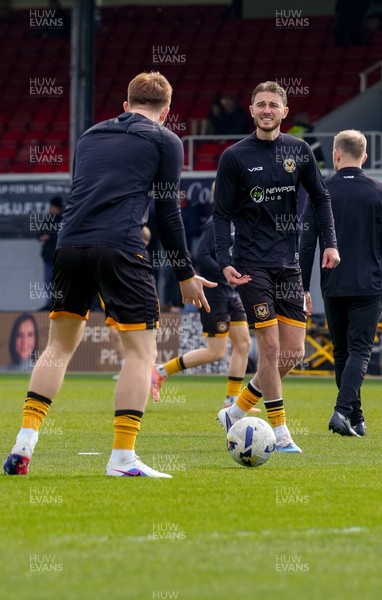 280326 - Newport County v Shrewsbury Town - Sky Bet League 2 - Matthew Baker of Newport County warms up prior to kick off