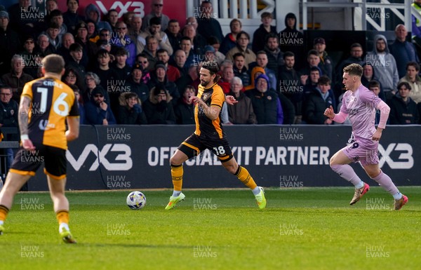 280326 - Newport County v Shrewsbury Town - Sky Bet League 2 - Liam Shephard of Newport County runs with the ball whilst under pressure from George Lloyd of Shrewsbury Town