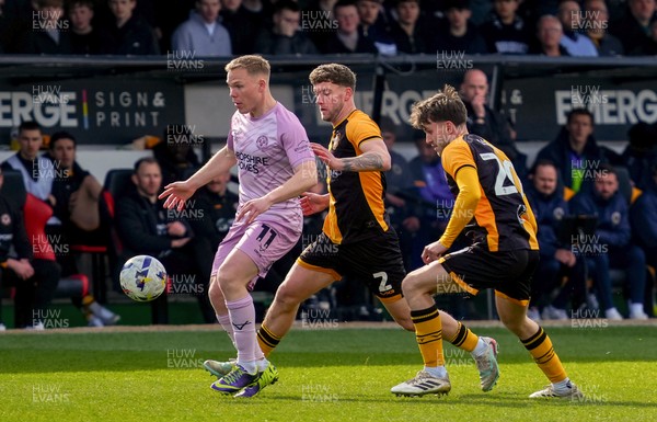 280326 - Newport County v Shrewsbury Town - Sky Bet League 2 - Anthony Scully of Shrewsbury Town controls the ball whilst under pressure from Cameron Evans and Ben Lloyd of Newport County