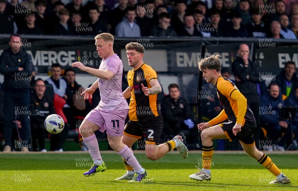 280326 - Newport County v Shrewsbury Town - Sky Bet League 2 - Anthony Scully of Shrewsbury Town controls the ball whilst under pressure from Cameron Evans and Ben Lloyd of Newport County