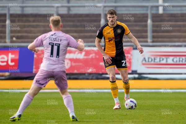 280326 - Newport County v Shrewsbury Town - Sky Bet League 2 - Ryan Delaney of Newport County controls the ball whilst under pressure from Anthony Scully of Shrewsbury Town