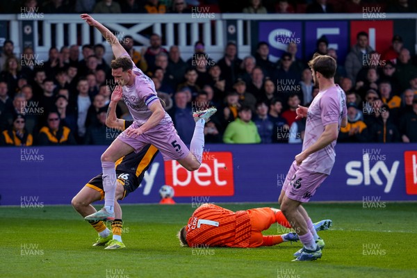 280326 - Newport County v Shrewsbury Town - Sky Bet League 2 - Matthew Cox of Shrewsbury Town gathers the ball from the feet of James Crole of Newport County and William Boyle of Shrewsbury Town