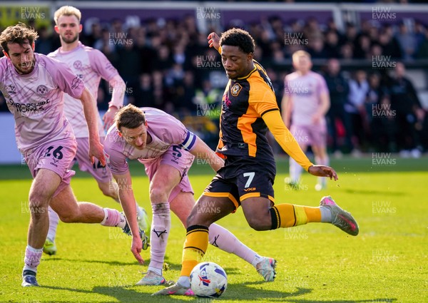 280326 - Newport County v Shrewsbury Town - Sky Bet League 2 - Bobby Kamwa of Newport County has a chance whilst under pressure from Sam Stubbs and William Boyle of Shrewsbury Town