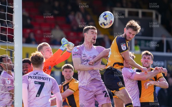 280326 - Newport County v Shrewsbury Town - Sky Bet League 2 - Matthew Cox of Shrewsbury Town punches the ball clear whilst under pressure from Matthew Baker of Newport County