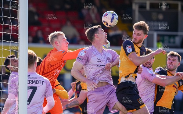 280326 - Newport County v Shrewsbury Town - Sky Bet League 2 - Matthew Cox of Shrewsbury Town punches the ball clear whilst under pressure from Matthew Baker of Newport County