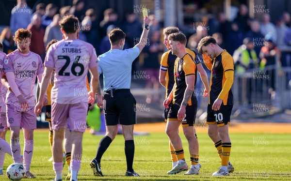280326 - Newport County v Shrewsbury Town - Sky Bet League 2 - Cameron Evans of Newport County is shown a yellow card