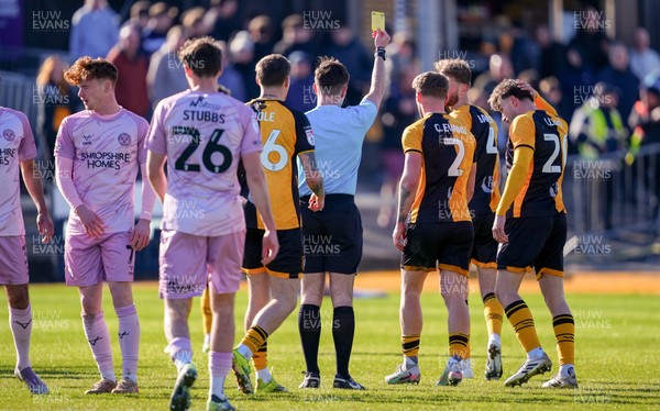 280326 - Newport County v Shrewsbury Town - Sky Bet League 2 - Cameron Evans of Newport County is shown a yellow card
