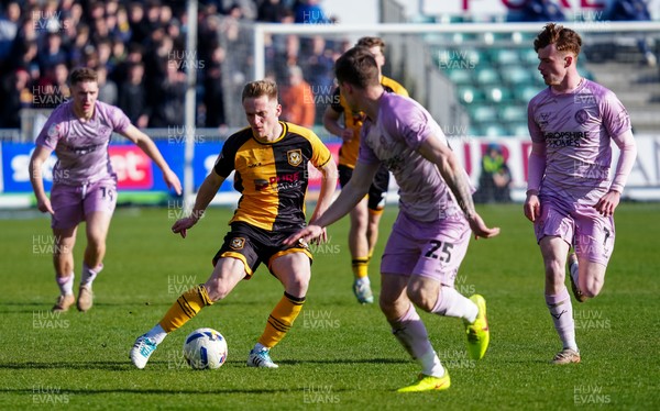 280326 - Newport County v Shrewsbury Town - Sky Bet League 2 - Matt Smith of Newport County runs with the ball whilst under pressure from Josh Ruffels of Shrewsbury Town