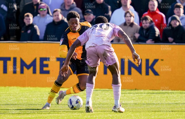 280326 - Newport County v Shrewsbury Town - Sky Bet League 2 - Bobby Kamwa of Newport County takes on  Kevin Berkoe of Shrewsbury Town