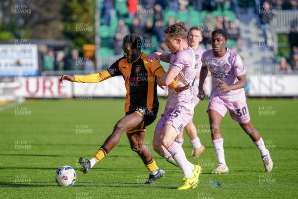 280326 - Newport County v Shrewsbury Town - Sky Bet League 2 - Nathan Opoku of Newport County is challenged by Josh Ruffels of Shrewsbury Town