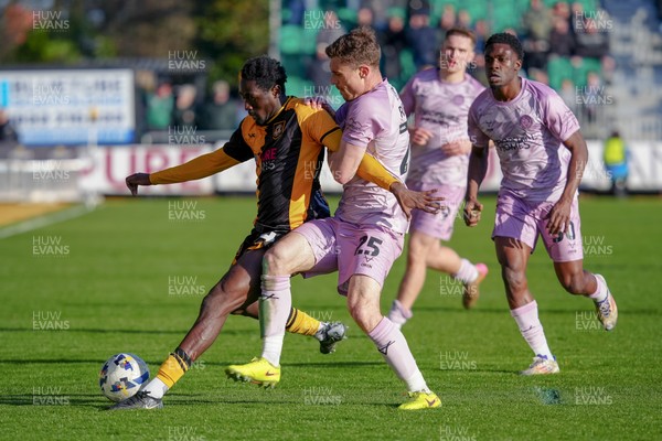 280326 - Newport County v Shrewsbury Town - Sky Bet League 2 - Nathan Opoku of Newport County is challenged by Josh Ruffels of Shrewsbury Town