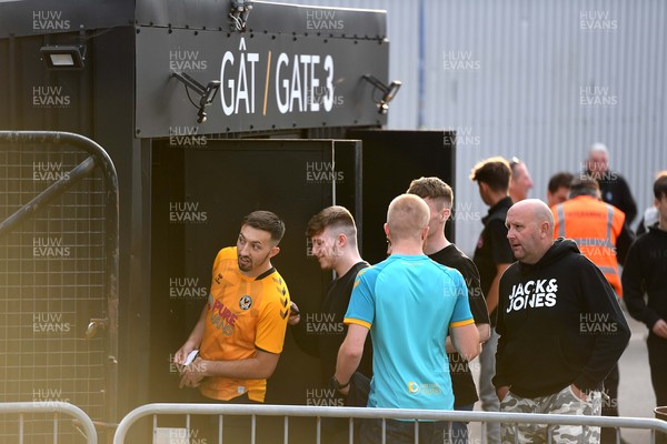 250821 - Newport County v Southampton - Carabao Cup - Newport County supporters make their way into the stadium ahead of kick off
