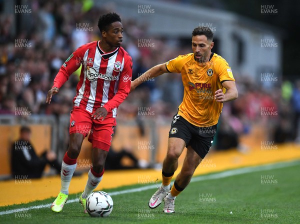 250821 - Newport County v Southampton - Carabao Cup - Kyle Walker-Peters of Southampton is tackled by Robbie Willmott of Newport County