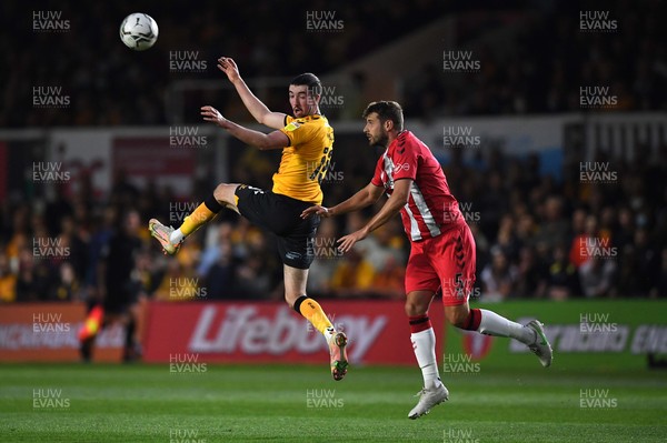 250821 - Newport County v Southampton - Carabao Cup - Finn Azaz of Newport County and Jack Stephens of Southampton compete in the air