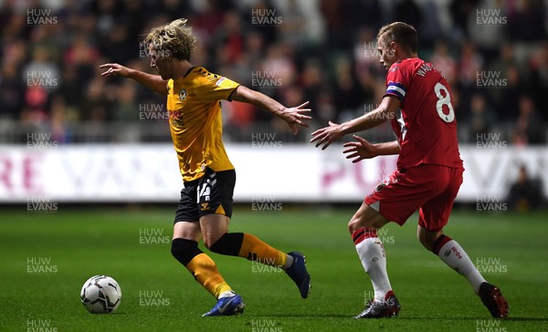 250821 - Newport County v Southampton - Carabao Cup - Aaron Lewis of Newport County gets away from James Ward-Prowse of Southampton