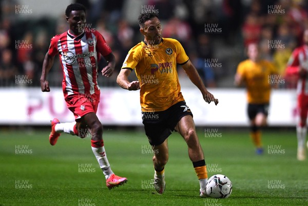 250821 - Newport County v Southampton - Carabao Cup - Robbie Willmott of Newport County gets away from Nathan Tella of Southampton