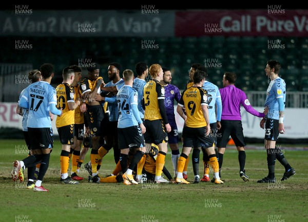 090221 - Newport County v Southend United, Sky Bet League 2 - Players square up to each other after a challenge on Mickey Demetriou of Newport County from Greg Halford of Southend United