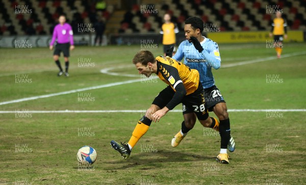 090221 - Newport County v Southend United, Sky Bet League 2 - Mickey Demetriou of Newport County and Ashley Nathaniel-George of Southend United compete for the ball