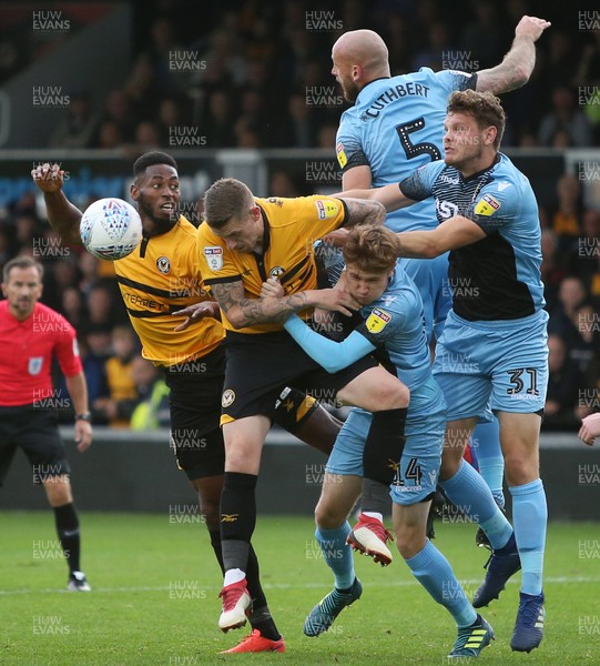 131018 - Newport County v Stevenage - SkyBet League Two - Jamille Matt and Scot Bennett of Newport try to get control of the ball