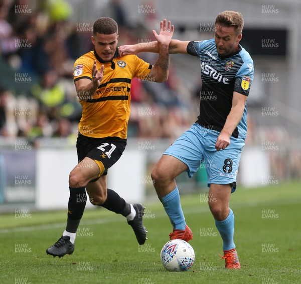 131018 - Newport County v Stevenage - SkyBet League Two - Tyler Hornby-Forbes of Newport is challenged by Joel Byrom of Stevenage