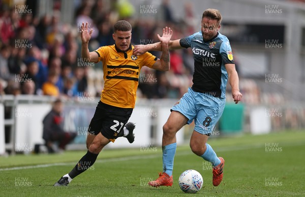 131018 - Newport County v Stevenage - SkyBet League Two - Tyler Hornby-Forbes of Newport is challenged by Joel Byrom of Stevenage