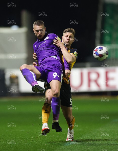 140223 - Newport County v Stevenage, EFL Sky Bet League 2 - Luke Norris of Stevenage and James Clarke of Newport County compete for the ball