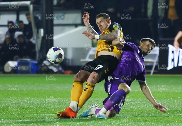 140223 - Newport County v Stevenage, EFL Sky Bet League 2 - Scot Bennett of Newport County and Josh March of Stevenage compete for the ball
