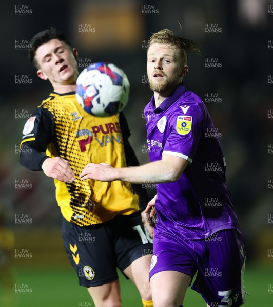 140223 - Newport County v Stevenage, EFL Sky Bet League 2 - Calum Kavanagh of Newport County and Max Clark of Stevenage compete for the ball