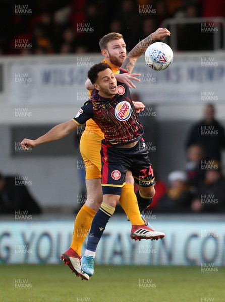 141219 - Newport County v Stevenage - SkyBet League Two - Elliott List of Stevenage and Mark O'Brien of Newport County go up for the ball