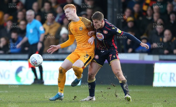 141219 - Newport County v Stevenage - SkyBet League Two - Ryan Haynes of Newport County is tackled by Charlie Carter of Stevenage
