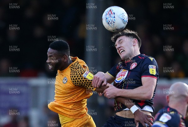 141219 - Newport County v Stevenage - SkyBet League Two - Jamille Matt of Newport County and Paul Digby of Stevenage go up for the ball